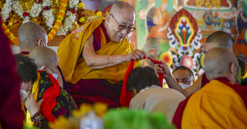 Bodh Gaya: Tibetan spritual leader Dalai Lama gives blessings to devotees in Bodh Gaya, Sunday Jan 1, 2023. (PTI Photo) (PTI01_01_2023_000054A)