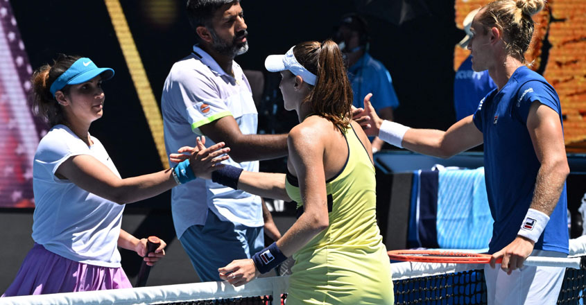Brazil's Luisa Stefani (front R) and Rafael Matos (back R) shake hands with India's Sania Mirza and Rohan Bopanna after their victory during the mixed doubles final on day twelve of the Australian Open tennis tournament in Melbourne on January 27, 2023. (Photo by Paul CROCK / AFP) / -- IMAGE RESTRICTED TO EDITORIAL USE - STRICTLY NO COMMERCIAL USE --