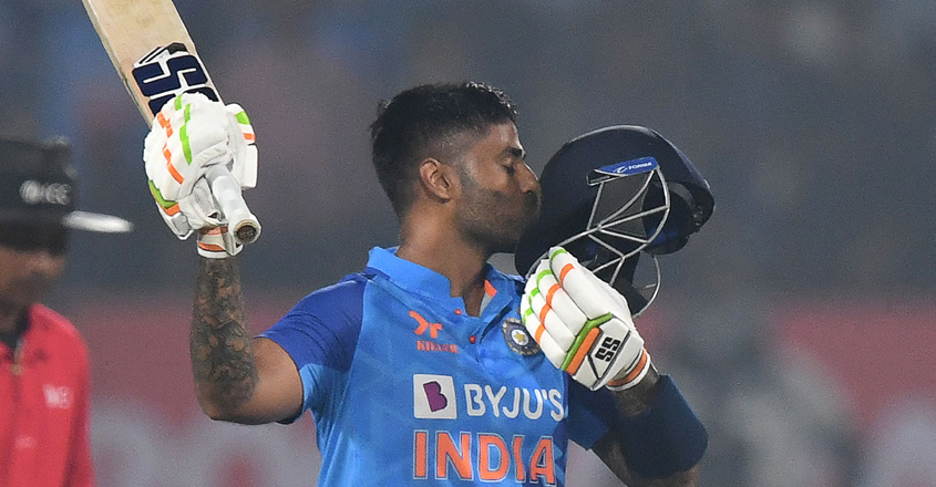 TOPSHOT - India's Suryakumar Yadav celebrates after scoring a century (100 runs) during the third Twenty20 international cricket match between India and Sri Lanka at the Saurashtra Cricket Association Stadium in Rajkot on January 7, 2023. (Photo by INDRANIL MUKHERJEE / AFP) / IMAGE RESTRICTED TO EDITORIAL USE - STRICTLY NO COMMERCIAL USE