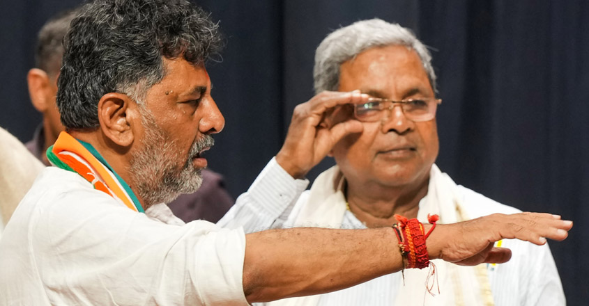 Bengaluru: Former Karnataka CM Siddaramaiah and Karnataka Congress President D.K. Shivakumar during celebrations after the party's win in Karnataka Assembly elections, in Bengaluru, Saturday, May 13, 2023. (PTI Photo/Shailendra Bhojak)(PTI05_13_2023_000447B)