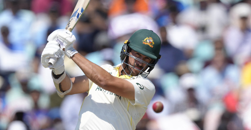 Australia's Mitchell Starc hits 4 runs on the fourth day of the ICC World Test Championship Final between India and Australia at The Oval cricket ground in London, Saturday, June 10, 2023. (AP Photo/Kirsty Wigglesworth)