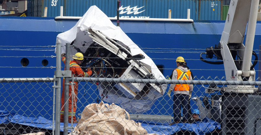 Debris from the Titan submersible, recovered from the ocean floor near the wreck of the Titanic, is unloaded from the ship Horizon Arctic at the Canadian Coast Guard pier in St. John's, Newfoundland, Wednesday, June 28, 2023. (Paul Daly/The Canadian Press via AP)