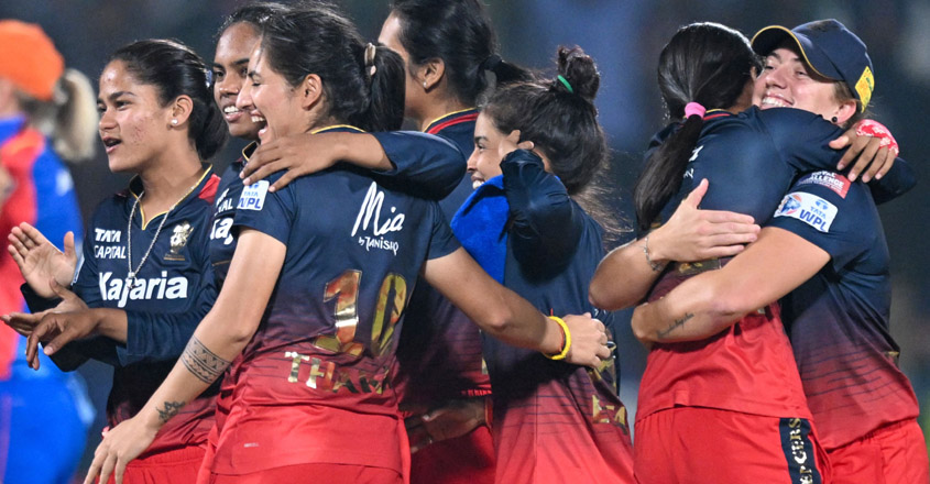 Royal Challengers Bangalore's players celebrate after winning the Women's Premier League (WPL) Twenty20 cricket final match against Delhi Capitals at the Arun Jaitley Stadium in New Delhi on March 17, 2024. (Photo by Sajjad HUSSAIN / AFP) / -- IMAGE RESTRICTED TO EDITORIAL USE - STRICTLY NO COMMERCIAL USE --