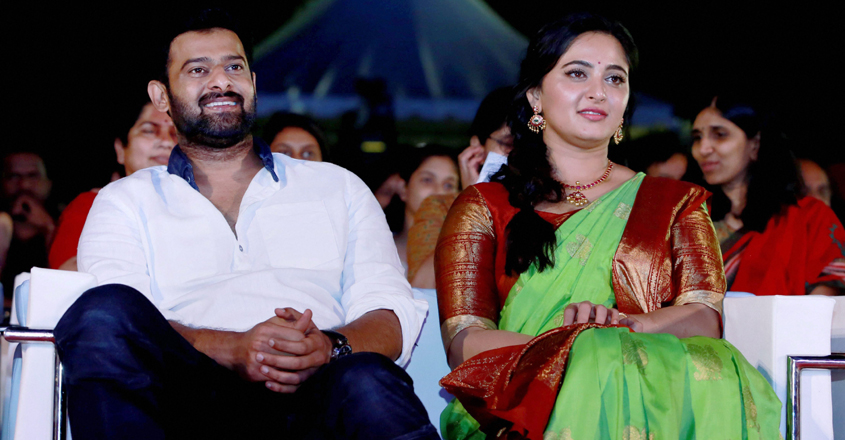 Chennai: Actor Prabhas with actress Anushka Shetty at the launch of  "Bahubali 2: The Conclusion" audio in Chennai on Sunday. PTI Photo (PTI4_10_2017_000178B)