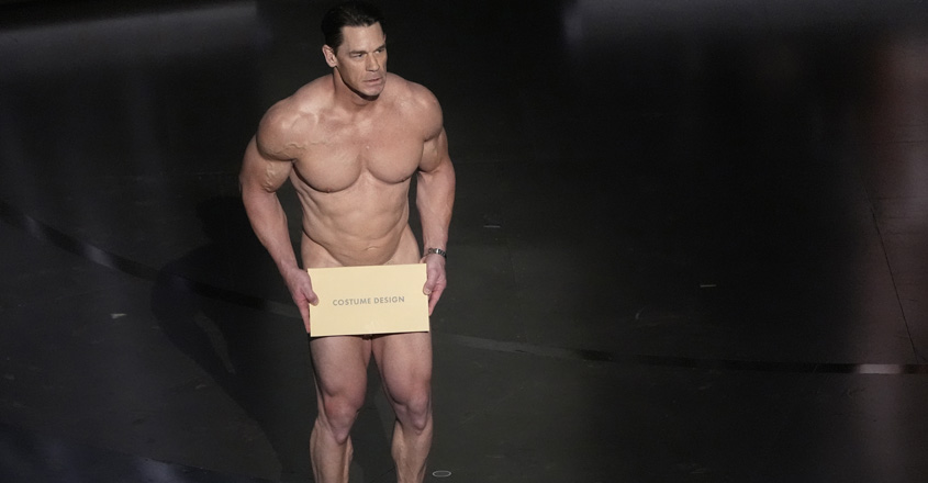 John Cena presents the award for best costume design during the Oscars on Sunday, March 10, 2024, at the Dolby Theatre in Los Angeles. (AP Photo/Chris Pizzello)
