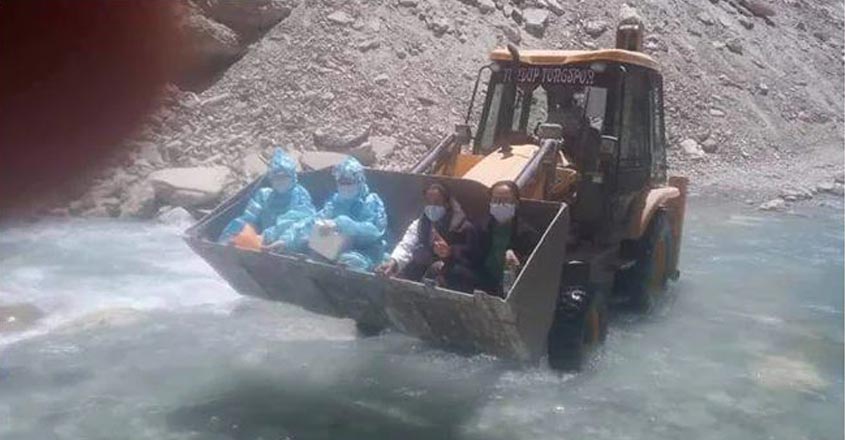 health-workers-crossing-river health-workers-crossing-river