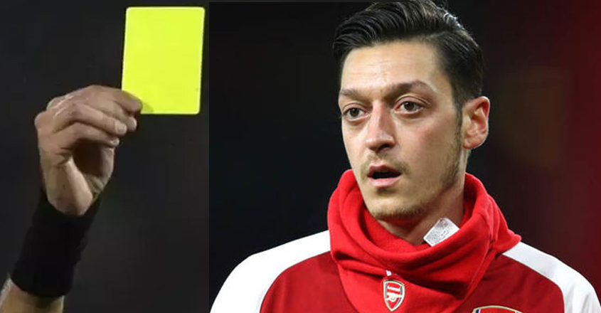 mesut-ozil-yellow-card