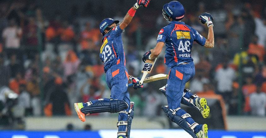 Lucknow Super Giants' Prerak Mankad (R) and Nicholas Pooran celebrate after winning the Indian Premier League (IPL) Twenty20 cricket match between Sunrisers Hyderabad and Lucknow Super Giants at the Rajiv Gandhi International Cricket Stadium in Hyderabad on May 13, 2023. (Photo by Noah SEELAM / AFP)