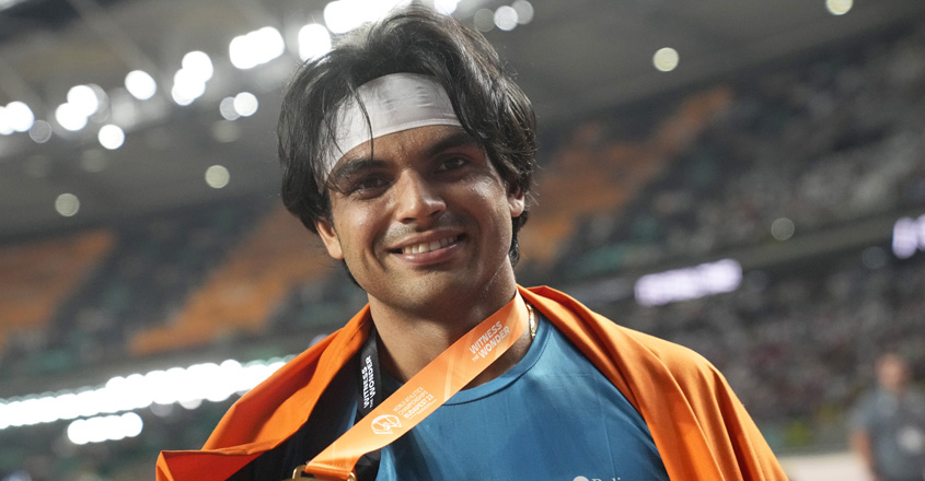 Neeraj Chopra, of India, poses after winning the gold medal in the Men's javelin throw final during the World Athletics Championships in Budapest, Hungary, Sunday, Aug. 27, 2023. (AP/PTI Photo)(AP08_28_2023_000008A)