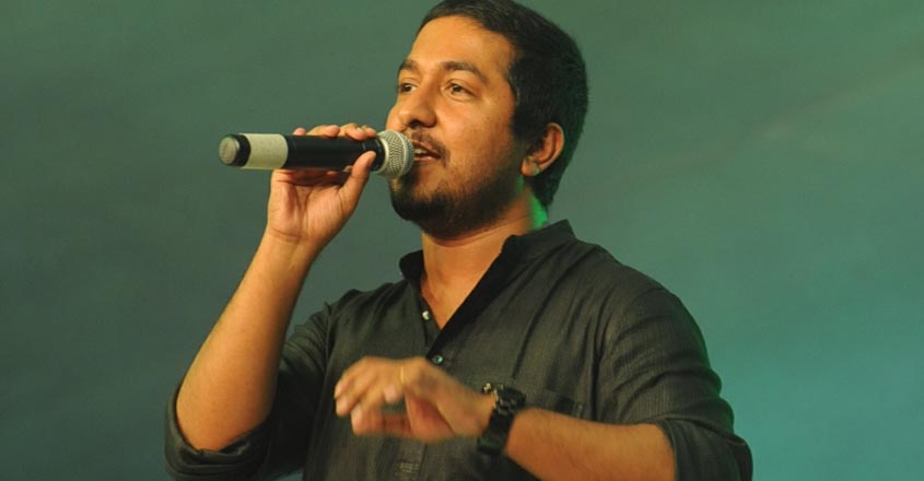 KOZHIKODE 28th August 2015 : Vineeth Sreenivasan - film actor - singer and director performing at DTPC Onam celebration  / Photo: James Arpookara , CLT #