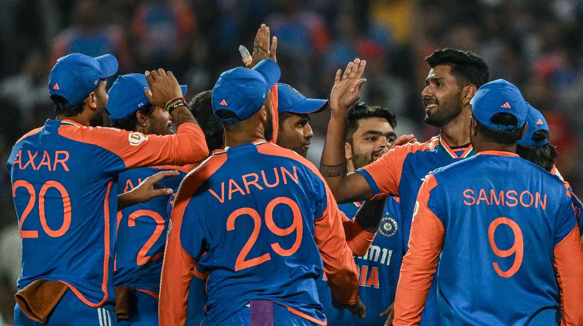 India's Harshit Rana (2R) celebrates with his teammates after taking the wicket of England's Liam Livingstone during the fourth Twenty20 international cricket match between India and England at the Maharashtra Cricket Association Stadium in Pune on January 31, 2025. (Photo by INDRANIL MUKHERJEE / AFP)