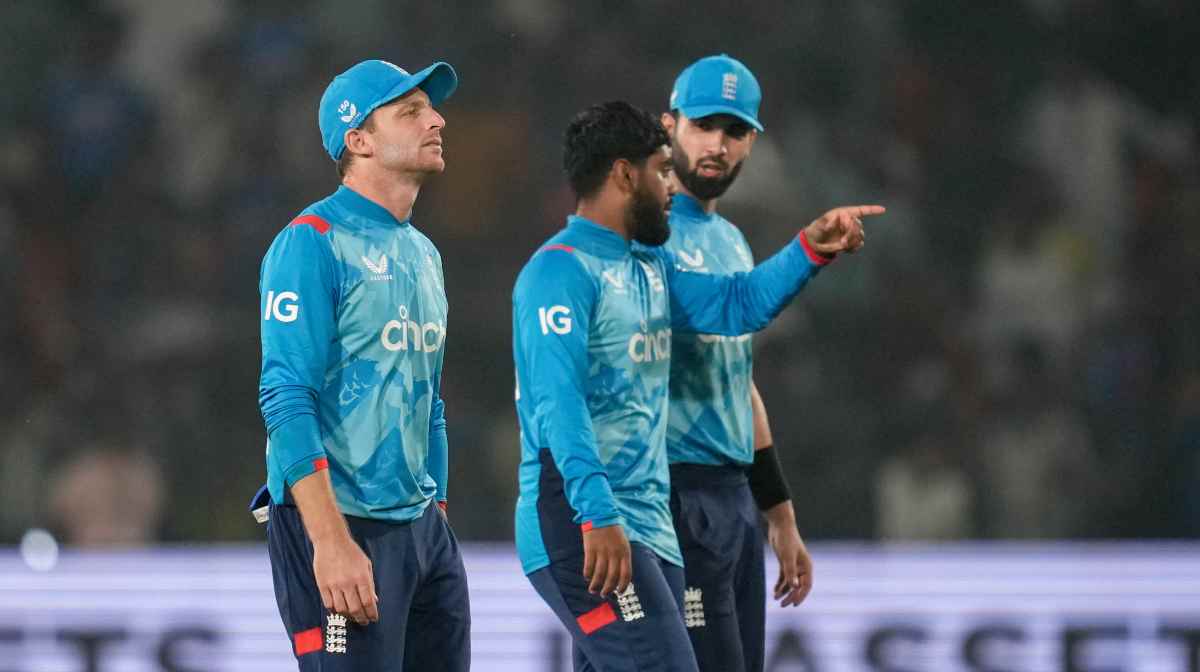 England's captain Jos Buttler, left, leaves the field after his side lost the second one day international cricket match against India in Cuttack, India, Sunday, Feb. 9, 2025. (AP Photo/Rafiq Maqbool)