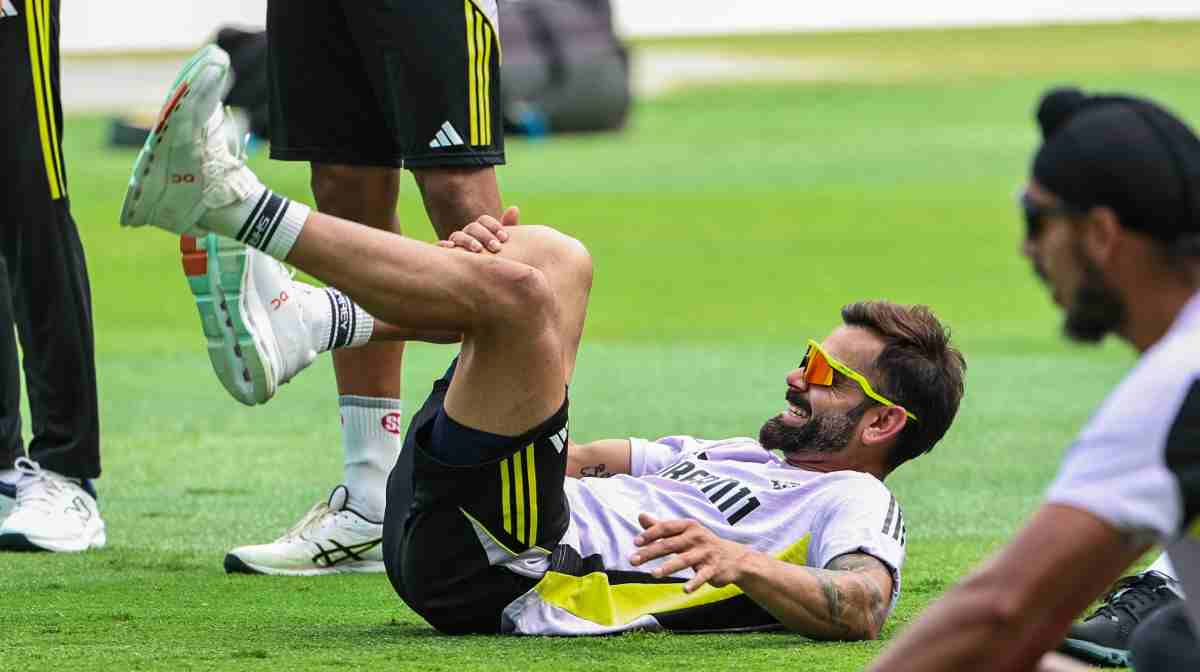 India's Virat Kohli stretches during a practice secisson a day ahead of the ICC Champions Trophy one-day international (ODI) cricket final match between India and New Zealand at Dubai International Stadium in Dubai on March 8, 2025. (Photo by FADEL SENNA / AFP)