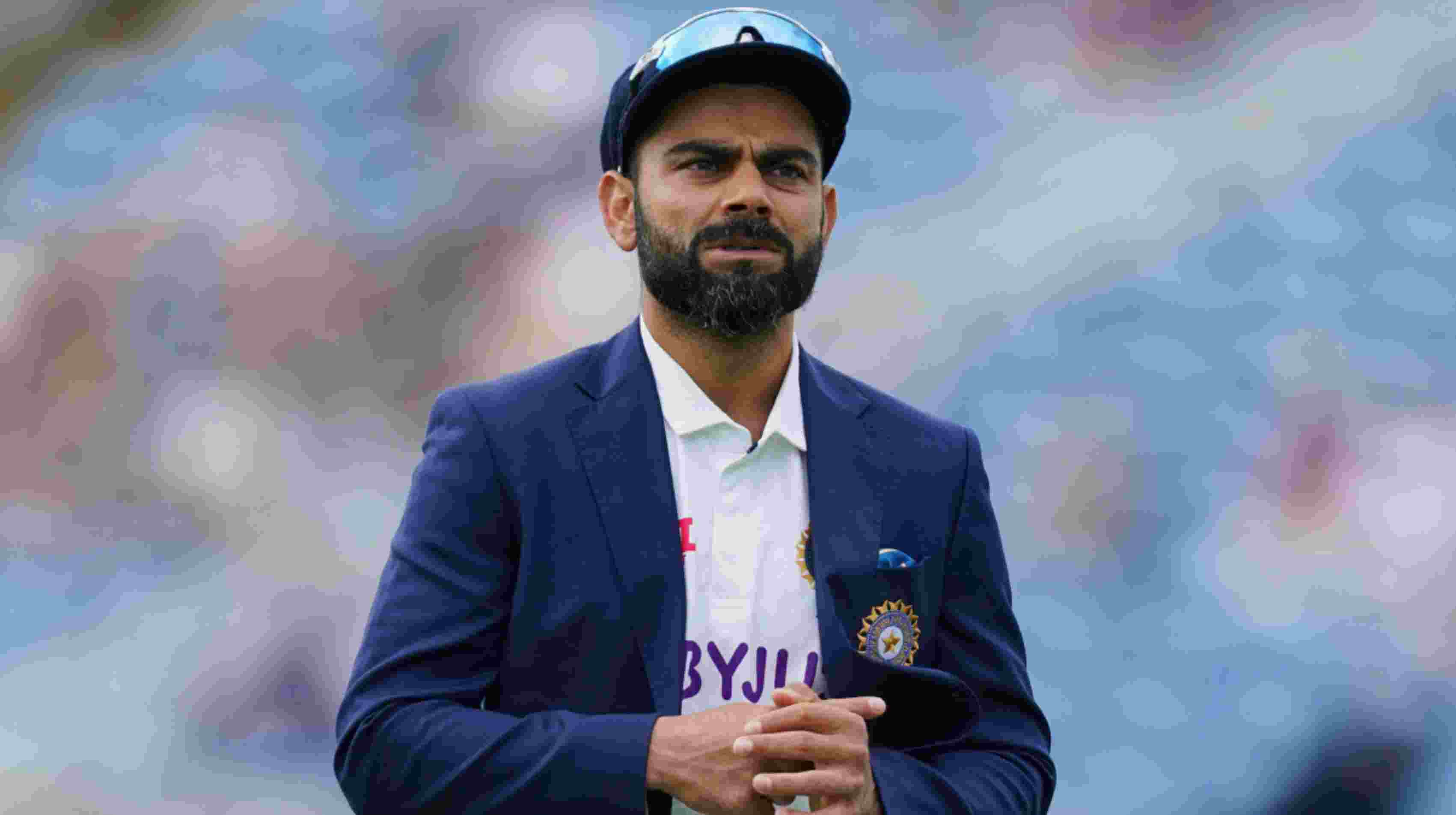 India's captain Virat Kohli walks back after the toss on the first day of third test cricket match between England and India, at Headingley cricket ground in Leeds, England, Wednesday, Aug. 25, 2021. (AP Photo/Jon Super)