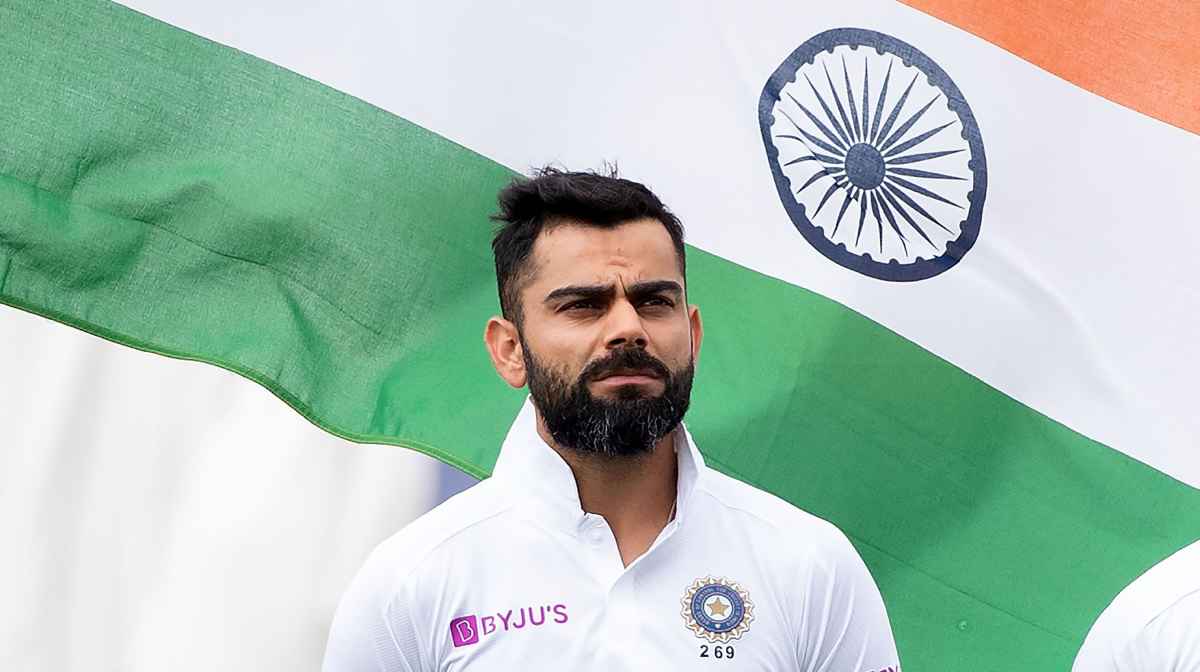 India's captain Virat Kohli stands on the field for the national anthems during day one of the first Test cricket match between New Zealand and India at the Basin Reserve in Wellington on February 21, 2020. (Photo by Marty MELVILLE / AFP)