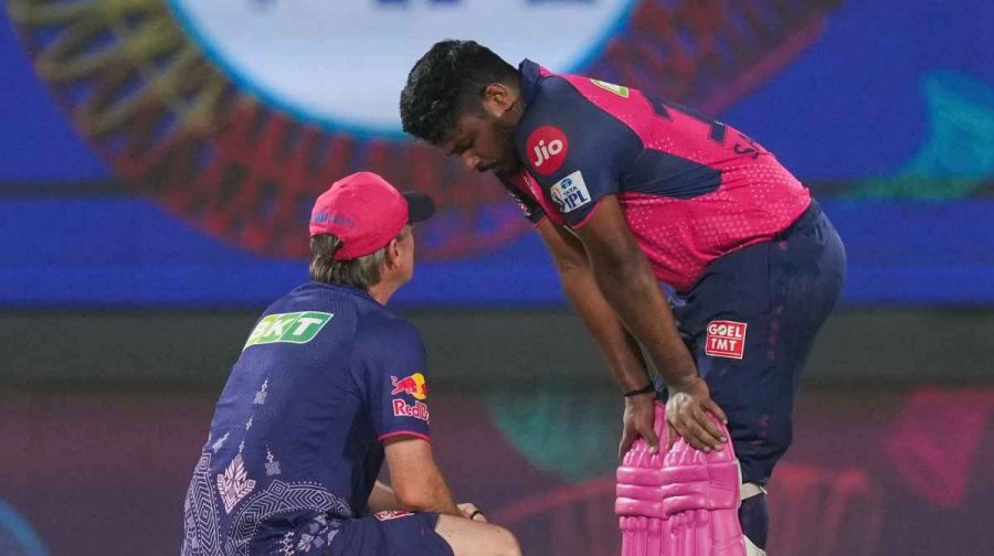 New Delhi: RR's Sanju Samson receives assistance from physio during the Indian Premier League 2025 cricket match between Rajasthan Royals (RR) and Delhi Capitals (DC), at Arun Jaitley Stadium in New Delhi, Wednesday, April 16, 2025. (PTI Photo/Arun Sharma)   (PTI04_16_2025_000534A) *** Local Caption ***  