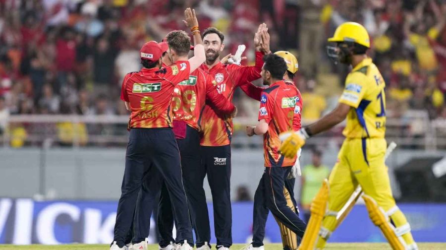 Punjab Kings' Glenn Maxwell with teammates celebrates the wicket of Chennai Super Kings' Rachin Ravindra