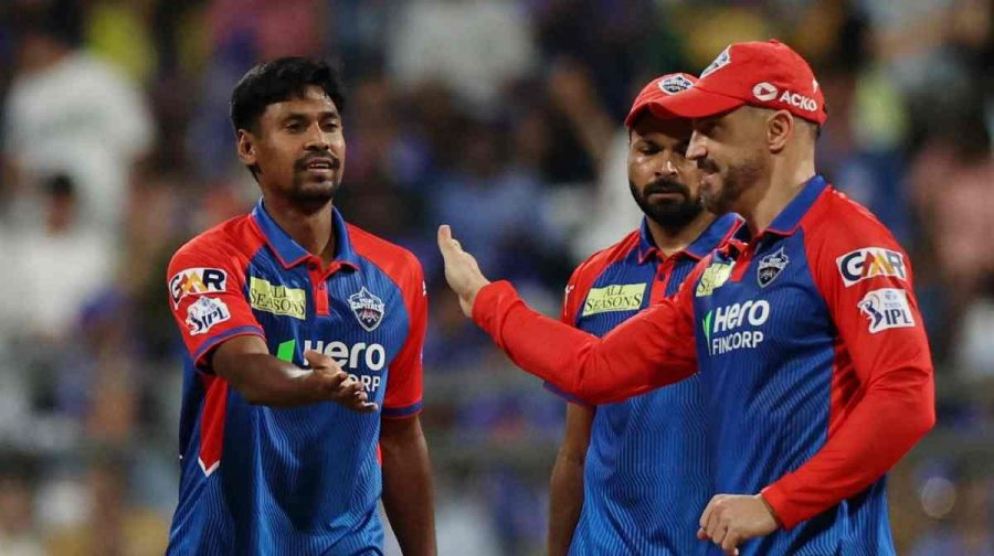 Cricket - Indian Premier League - IPL - Mumbai Indians v Delhi Capitals - Wankhede Stadium, Chennai, India - May 21, 2025Delhi Capitals' Mustafizur Rahman celebrates with Faf du Plessis and Mukesh Kumar after taking the wicket of Mumbai Indians' Rohit Sharma, caught out by Abishek Porel REUTERS/Francis Mascarenhas