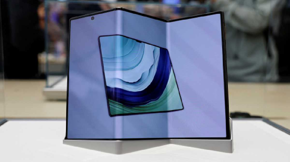 Huawei's new tri-foldable smartphone Mate XT is seen displayed in a glass case at a Huawei flagship store in Beijing, China September 10, 2024