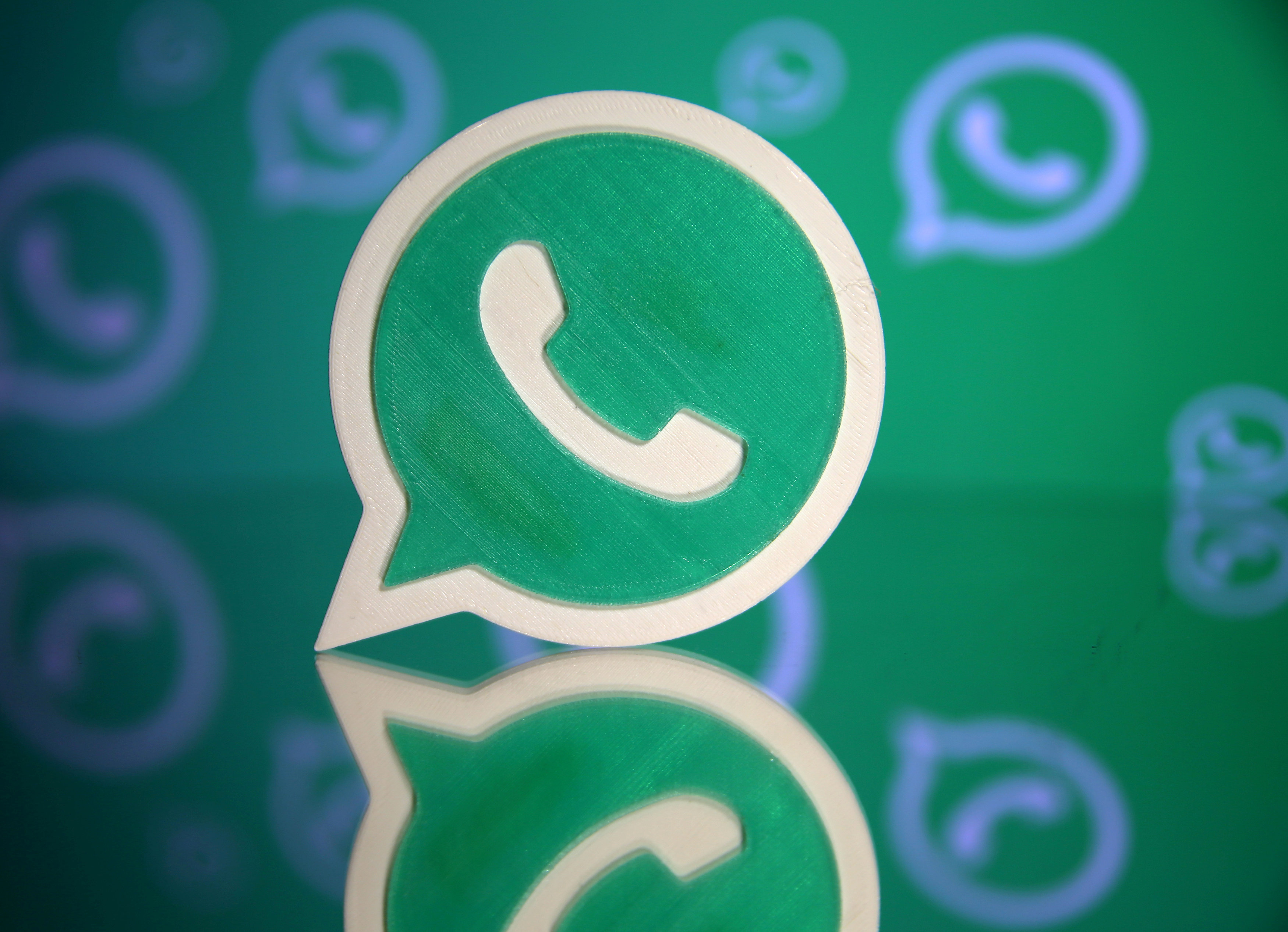 FILE PHOTO: A 3D printed Whatsapp logo is seen in front of a displayed Whatsapp logo in this illustration September 14, 2017. REUTERS/Dado Ruvic/File Photo