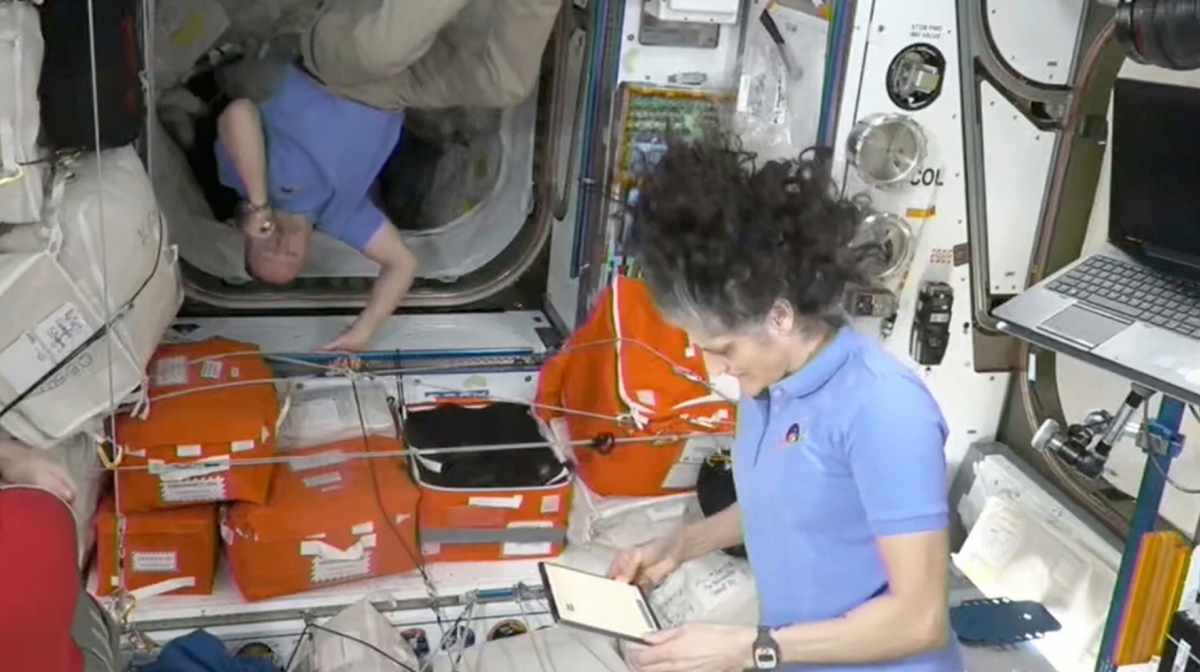 This image made from video by NASA shows Russian astronaut Alexei Ovchinin, left, Butch Wilmore, center, and Suni Williams wait to greet newly arrived astronauts after the SpaceX capsule docked with the International Space Station, Sunday, March 16, 2025.AP/PTI(AP03_16_2025_000051A)